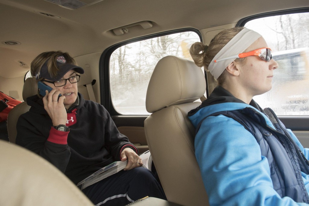 Jennifer Dulski (right) drives while Molly Goodwin (left) talks on the phone to vendors to make sure that the team’s helmets will arrive in time for their scrimmage against women’s football teams in the Independent Women’s Football League, Pittsburgh Passion, Washington Prodigy, and Philadelphia Firebirds in Philadelphia, March 21, 2015. (Wicked Local Staff Photo/ Sam Goresh) 