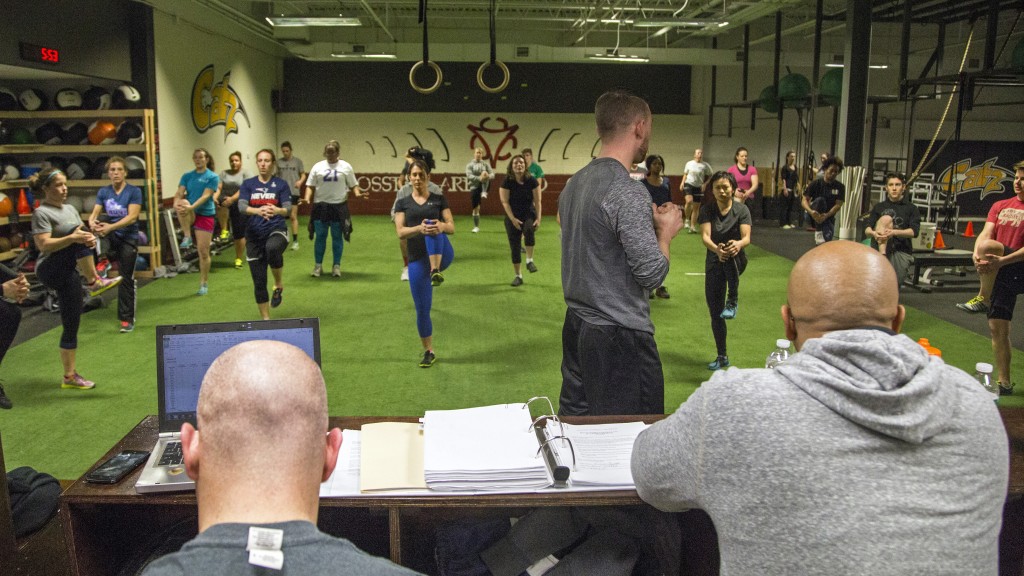 Trainer Jeremy Rubera leads the team through conditioning at CrossFit ARES in Wilmington in February. —Guru Amar Khalsa/Boston.com
