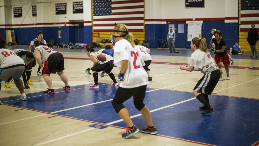 Allison Cahill receives a snap during practice at Revere High School.—Guru Amar Khalsa/Boston.com