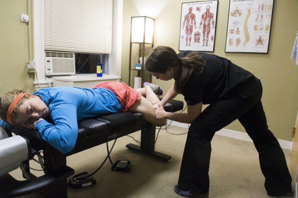 Boston Renegades player Betsy Calkins visits Dr. Abbie Zubiel a chiropractic sports physician, to treat some of her knee pain, June 1, 2015. (Wicked Local Staff Photo/ Sam Goresh)