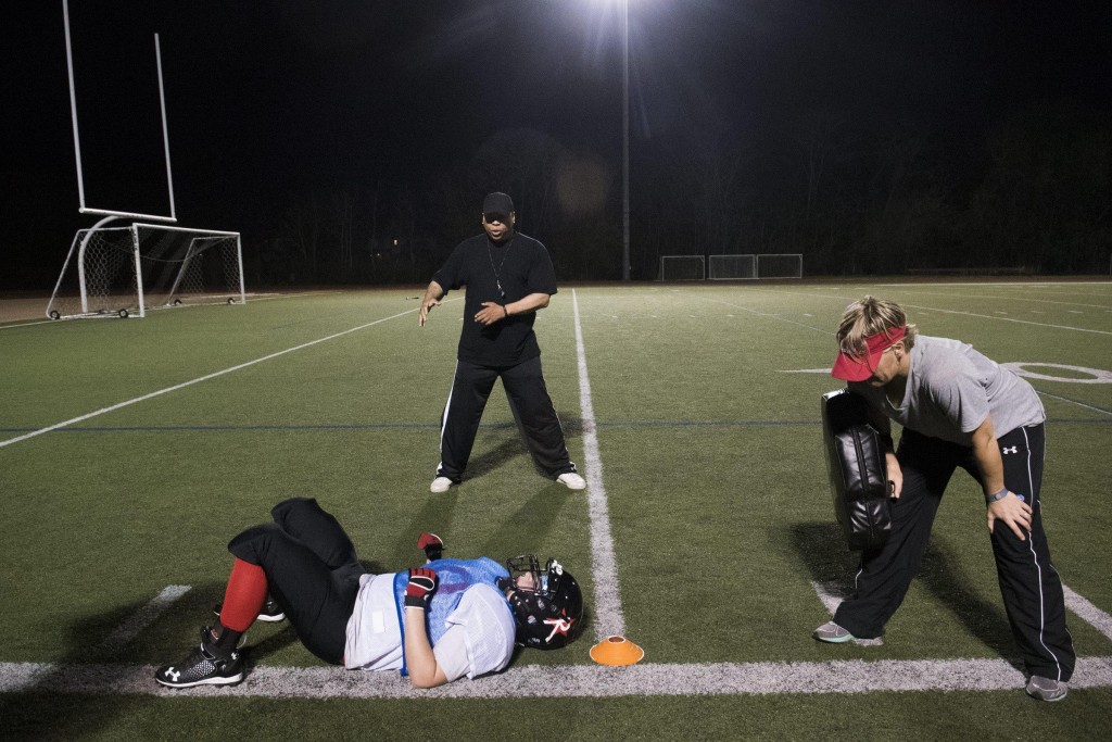 Defensive coaches Alan Lockhart (top) and Molly Goodwin (right) lead players through drills at the Boston Renegades Practice at Dilboy Stadium, May 12, 2015. (Wicked Local Staff Photo/ Sam Goresh)