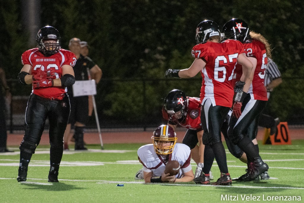 Boston Renegades All-American defenders sack a quarterback