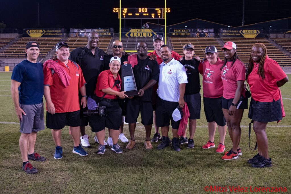 Photographer Mitzi Velez Lorenzana and the coaches of the Boston Renegades.