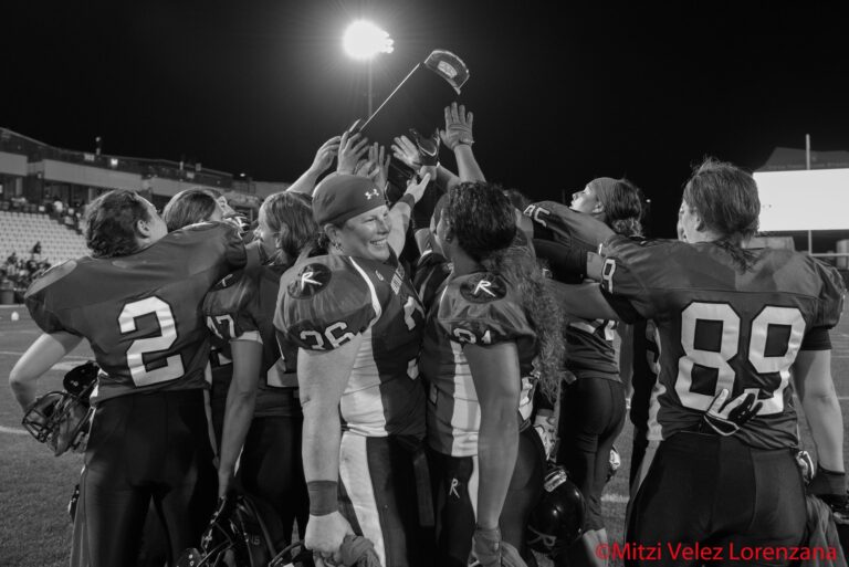 Boston Renegades players raise the WFA championship trophy