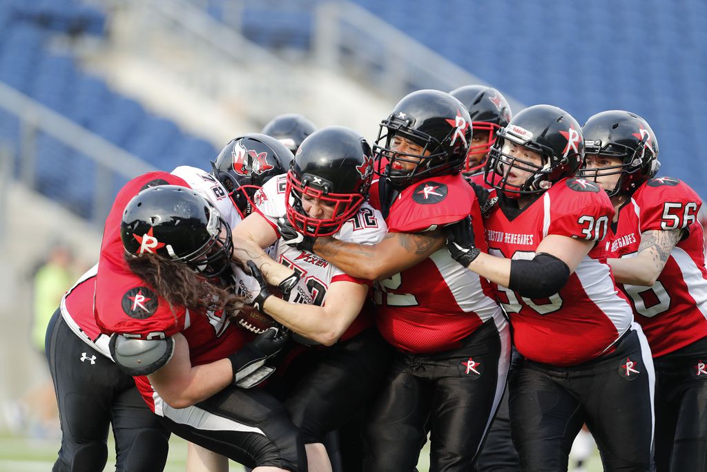Grace Cooper of the Minnesota Vixen gets tackled by a swarm of Boston Renegades