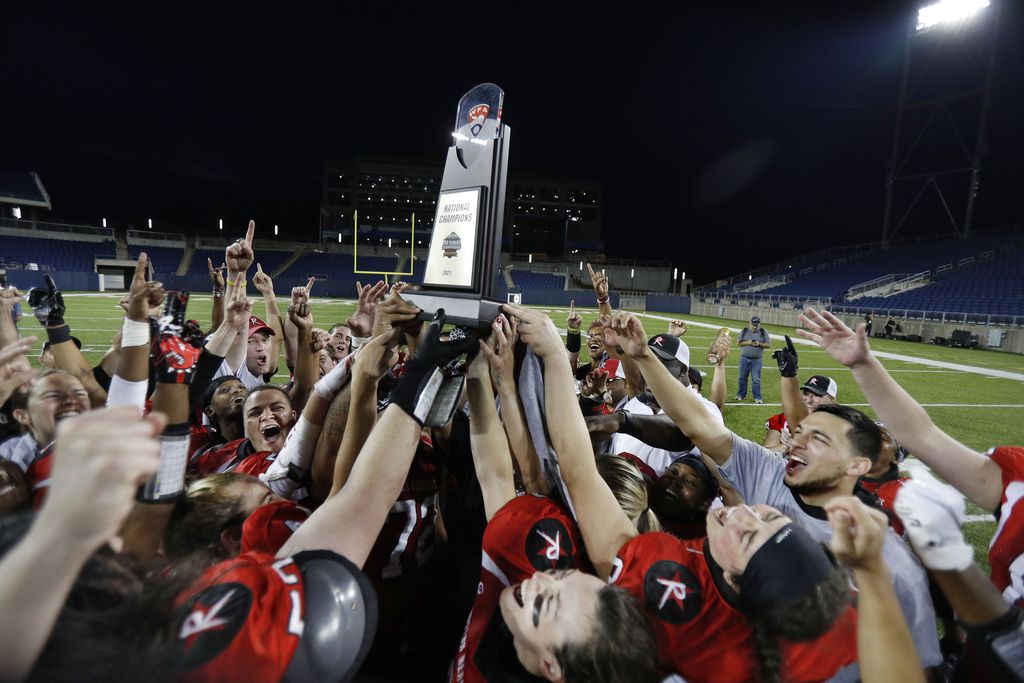 Boston Renegades players raise the championship trophy