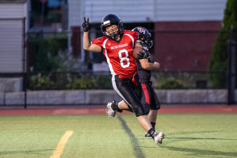 Lauren Yung celebrates asfter catching a touchdown pass