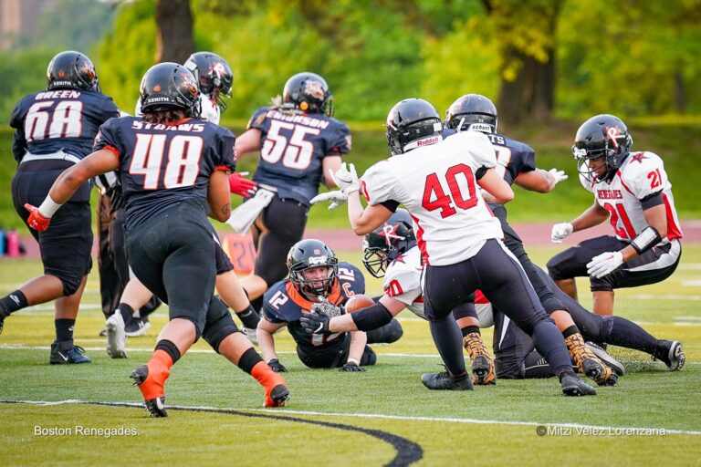 Taylor Hay of the St. Louis Slam fumbles a football.