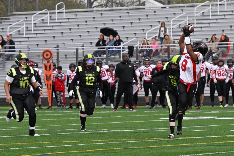 Boston Renegades player catching a football.