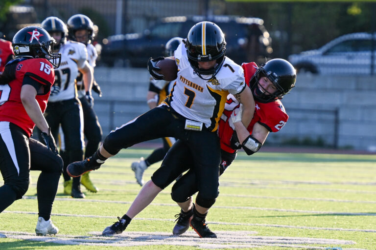 Boston Renegades defensive back Jocelyn Forrest #26 brings down Amanda Haeg #7 of the Pittsburgh Passion.