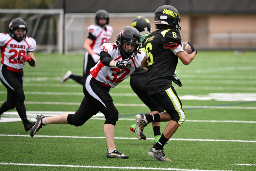 Kara Gailiunas of the Boston Renegades tackles a Detroit Venom player.