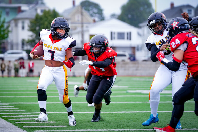 Renegades defenders Whitney Zelee #33 and Briannah Gallo #24 box in Running Back Kelli Smith #7 of the Alabama Fire.b ©Mitzi Velez Lorenzana