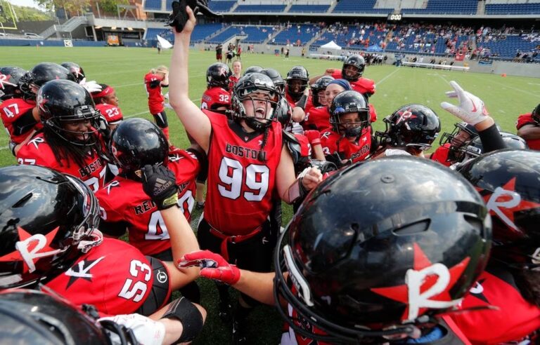 Molly Winsten celebrates the Boston Renegades' fifth consecutive WFA championship victory with teammates.